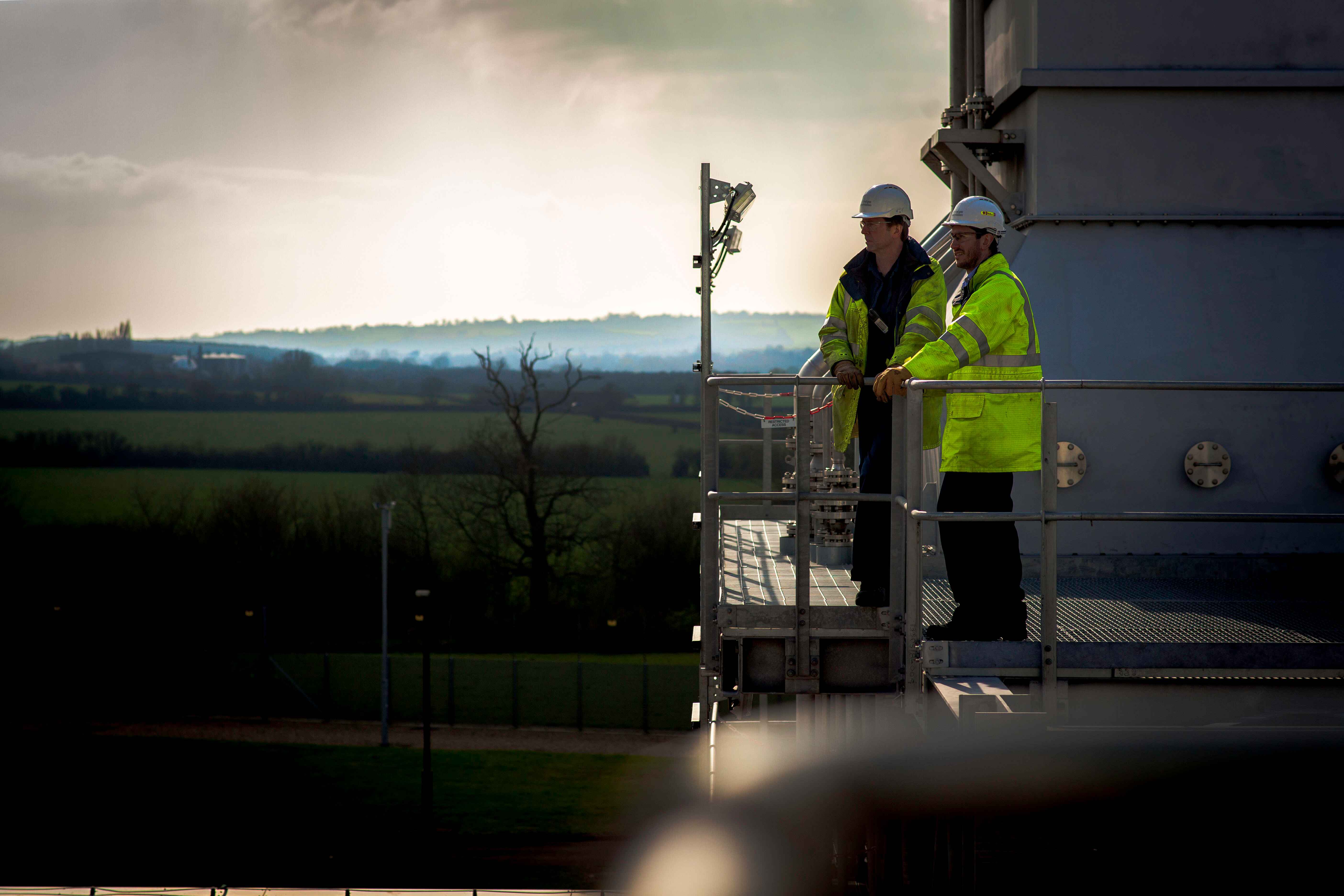 men working at compressor stack