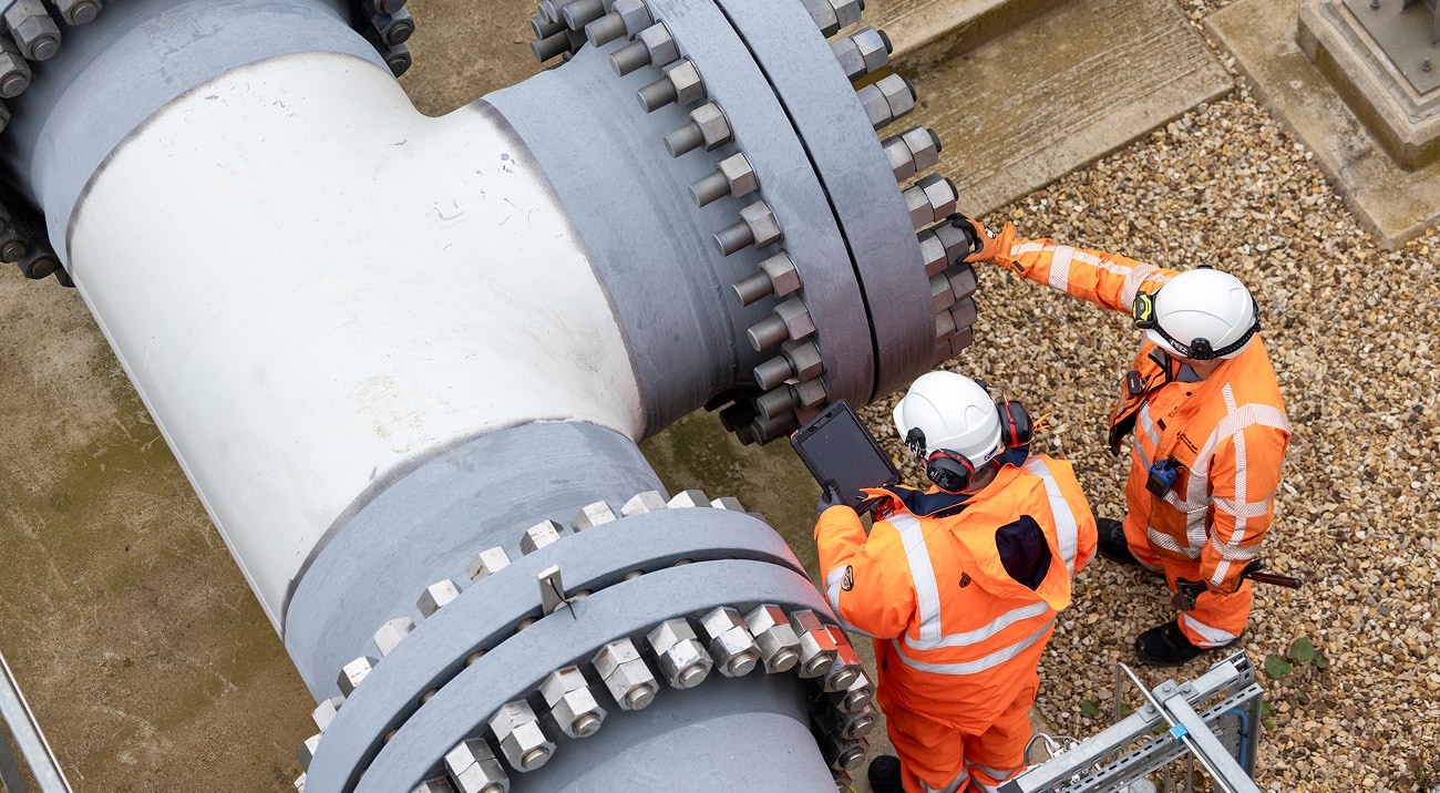 Engineers inspecting gas pipeline infrastructure.