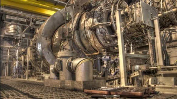 An inside view of an electricity structure with large mechanical elements on display 