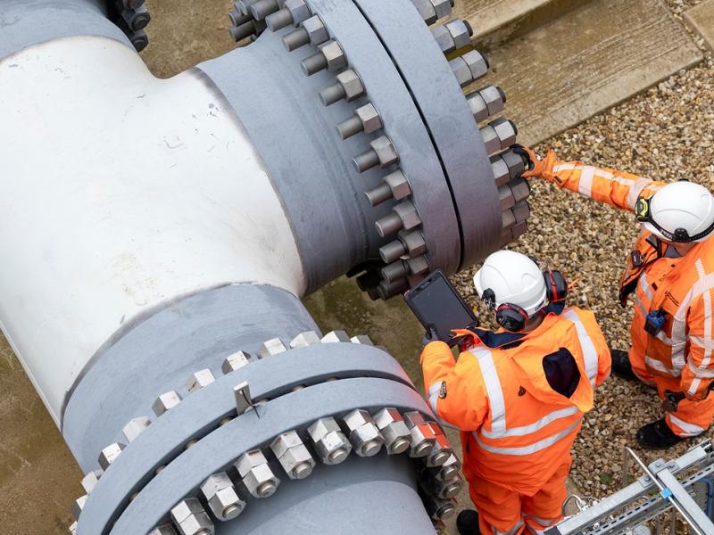 Engineers inspecting gas pipeline infrastructure.